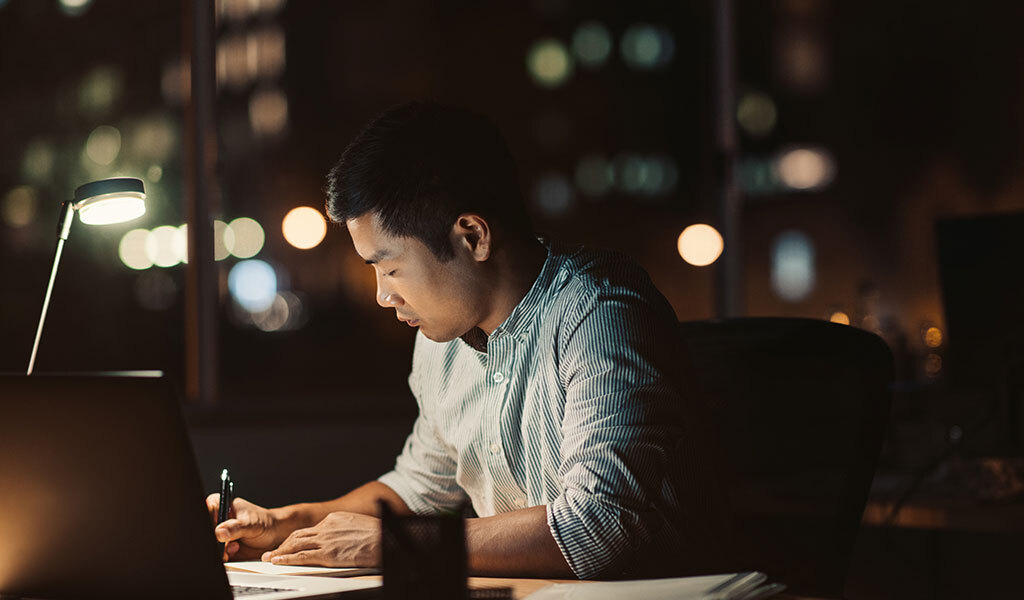 A person working late, coming up with digital strategy for SMB