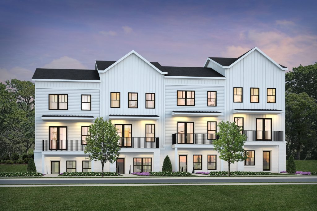 An architectural rendering of townhomes at dusk