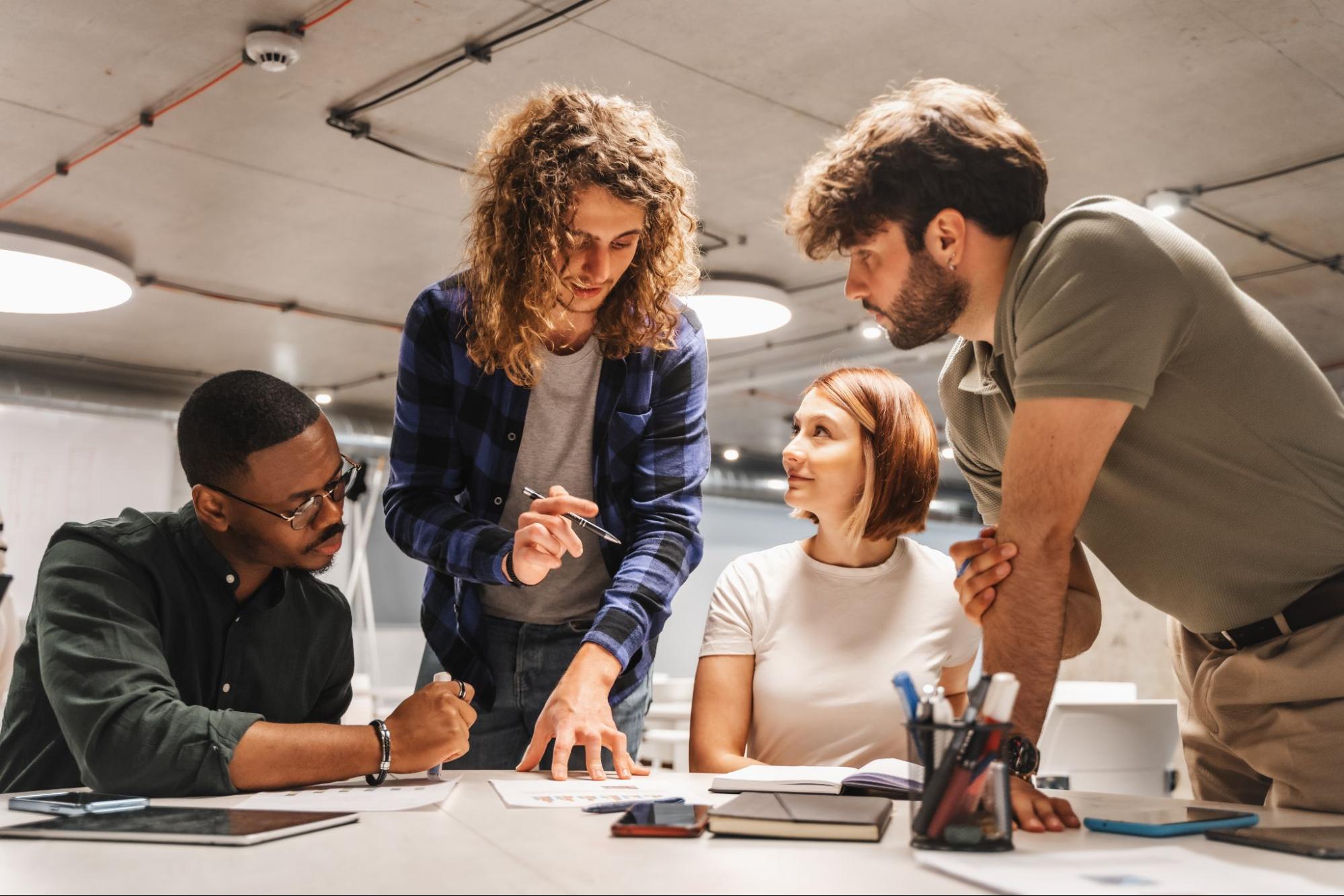 A creative team discussing high-quality printing services for a client project.